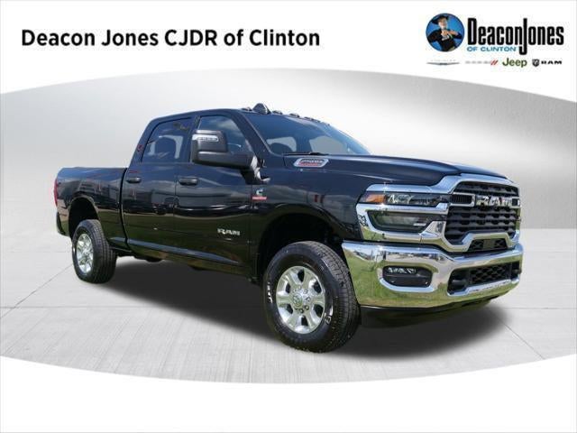 2025 RAM Ram 2500 RAM 2500 BIG HORN CREW CAB 4X4 6'4' BOX in Diamond Black Crystal Pearl-Coat Exterior Paint — front three-quarter view